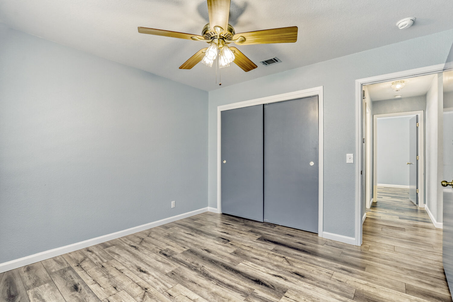 2529 Tandi Trail Round Rock, TX 78664 - Photo 22 of 32 a view of a livingroom with wooden floor and a ceiling fan