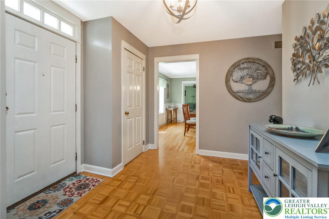 1553 Surrey Road Bethlehem, PA 18015 - Photo 6 of 92 A welcoming entryway with parquet flooring opens to an adjacent dining area.