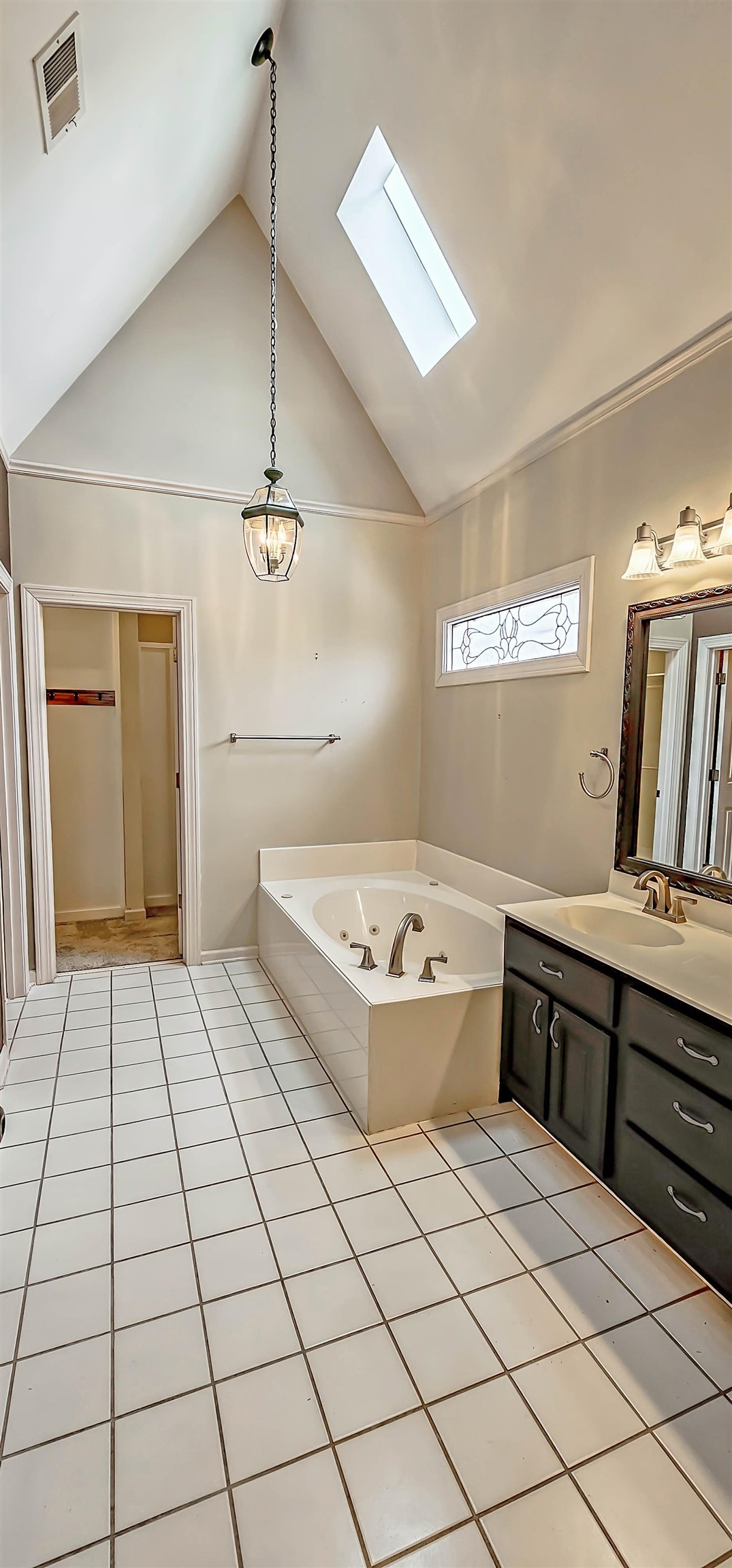 660 Weston Drive Collierville, TN 38017 - Photo 16 of 32 a spacious bathroom with a granite countertop sink a mirror and a bathtub
