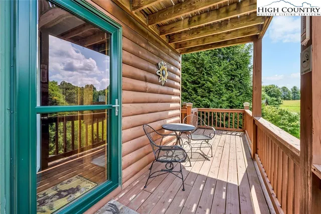 a view of a balcony with wooden floor