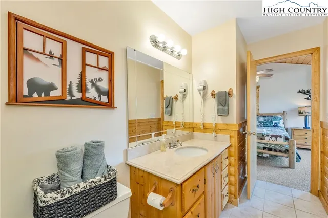 a bathroom with a sink a mirror and a shower