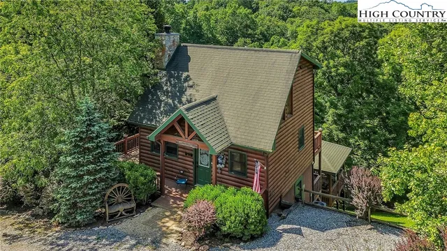a view of a house with a yard and plants