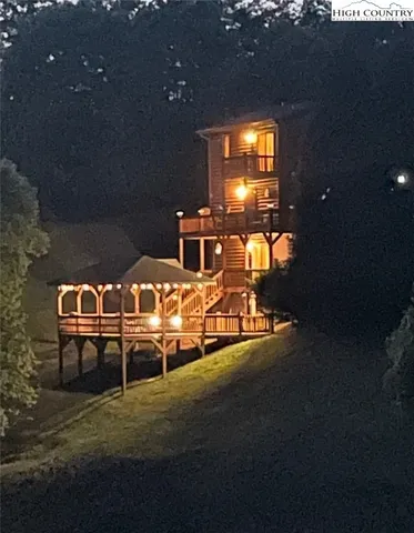 a view of a yard with wooden fence