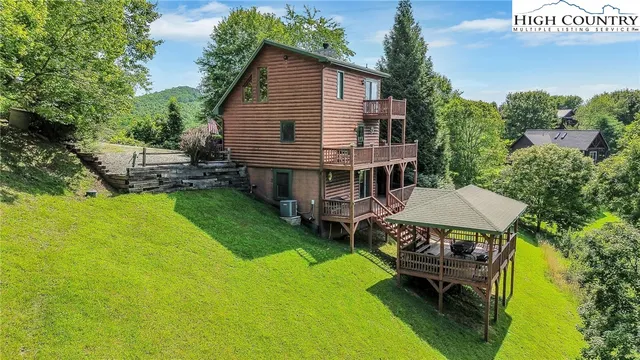 aerial view of a house with a yard table and chairs