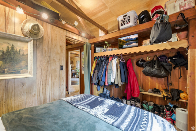 6631 Pine Springs Road Kamas, UT 84036 - Photo 16 of 48 Bedroom featuring wooden walls, vaulted ceiling with beams, and wood ceiling