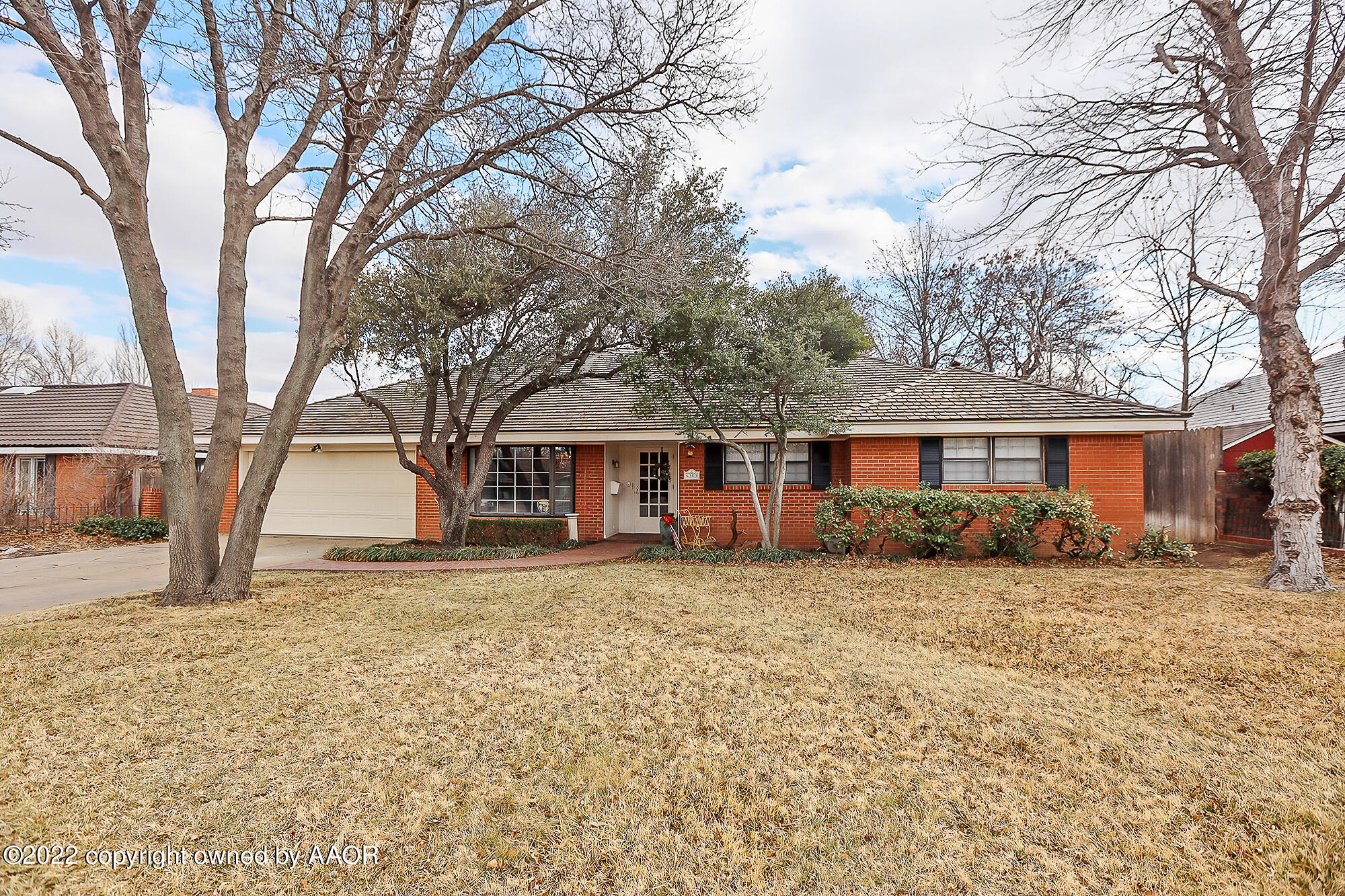 6303 Calumet Road Amarillo, TX 79106 - Photo 1 of 31 a front view of a house with a yard