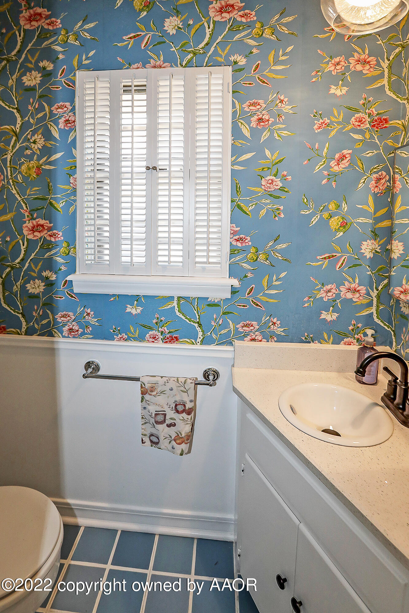 6303 Calumet Road Amarillo, TX 79106 - Photo 12 of 31 a bathroom with a sink a toilet and a shower curtain
