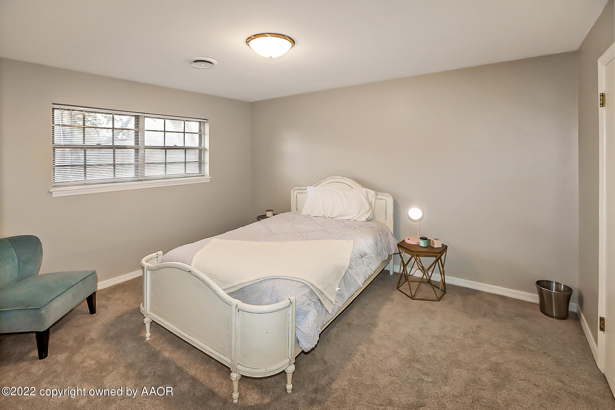 6303 Calumet Road Amarillo, TX 79106 - Photo 18 of 31 a bed room with a bed and a chair