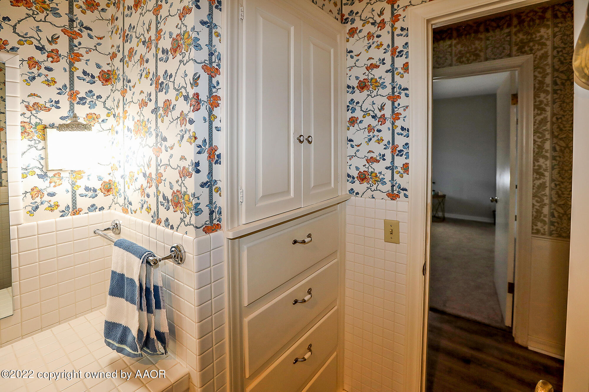 6303 Calumet Road Amarillo, TX 79106 - Photo 23 of 31 a bathroom with a shower and a mirror
