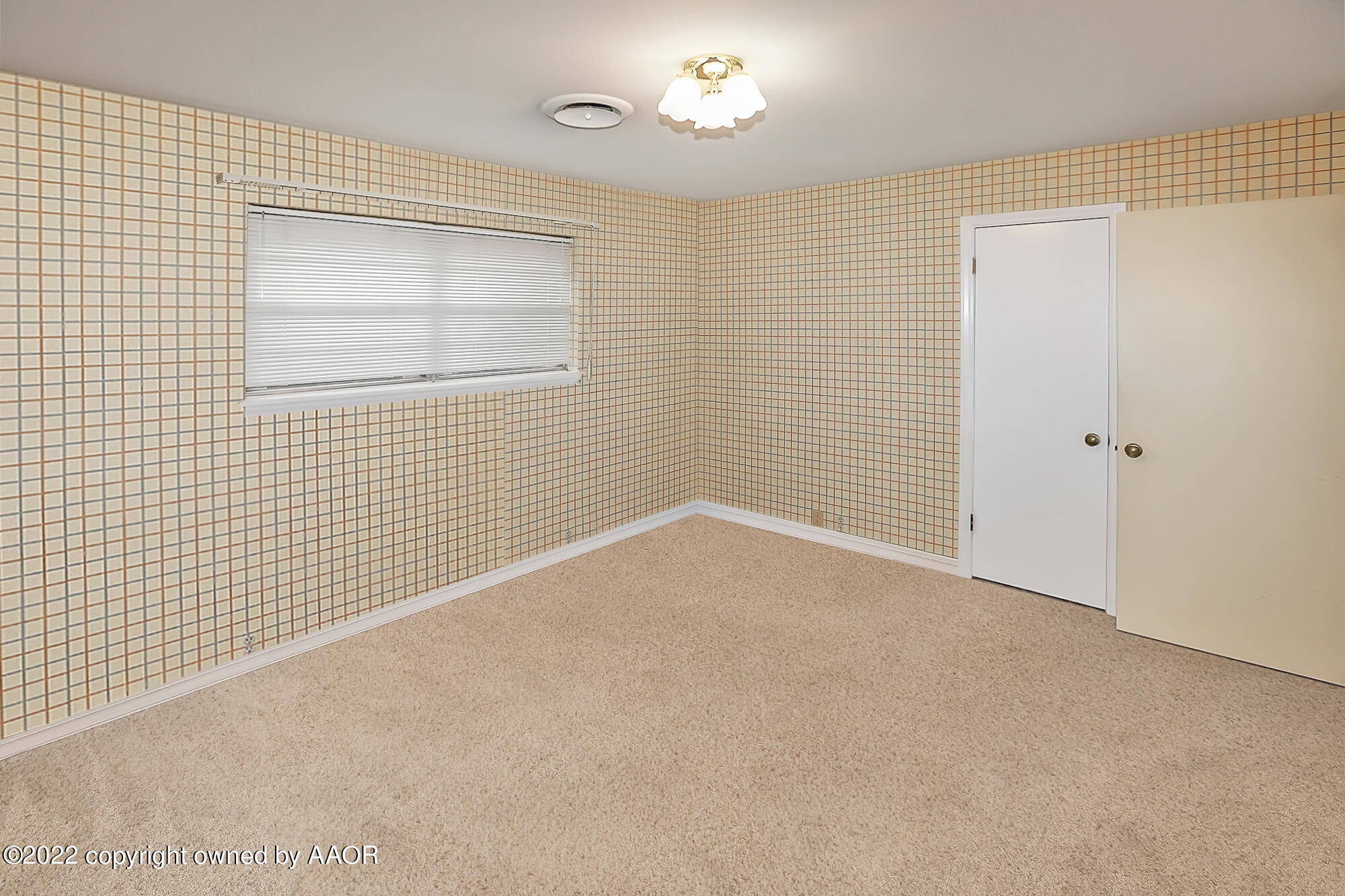 6303 Calumet Road Amarillo, TX 79106 - Photo 24 of 31 a view of an empty room with a window