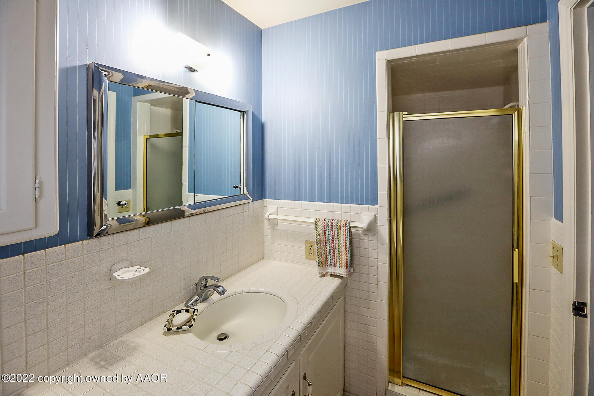 6303 Calumet Road Amarillo, TX 79106 - Photo 28 of 31 a bathroom with a sink vanity and mirror