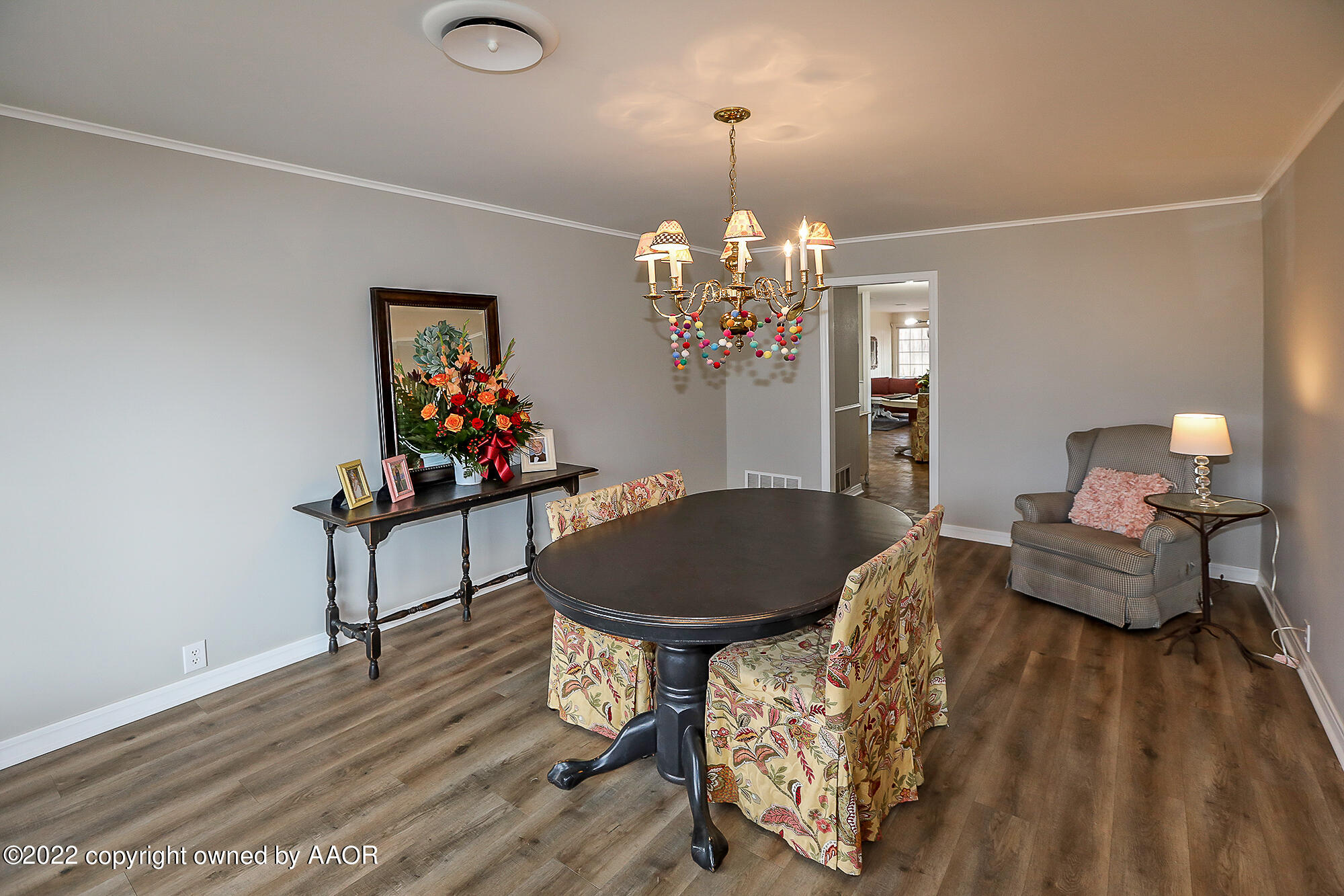 6303 Calumet Road Amarillo, TX 79106 - Photo 4 of 31 a living room with furniture and a chandelier