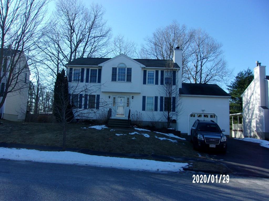 a front view of a house with yard