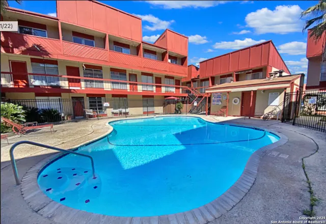a view of a building with a swimming pool