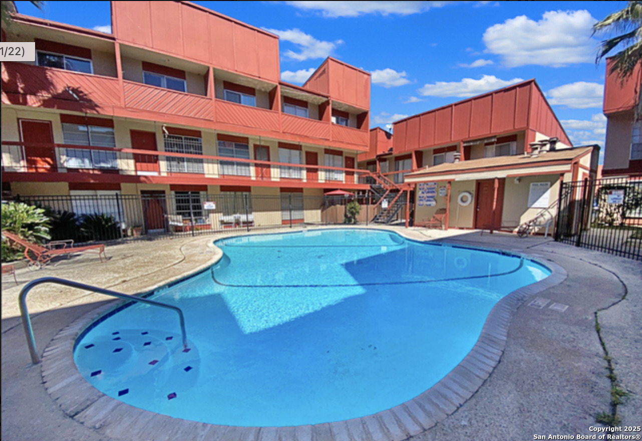 a view of a building with a swimming pool