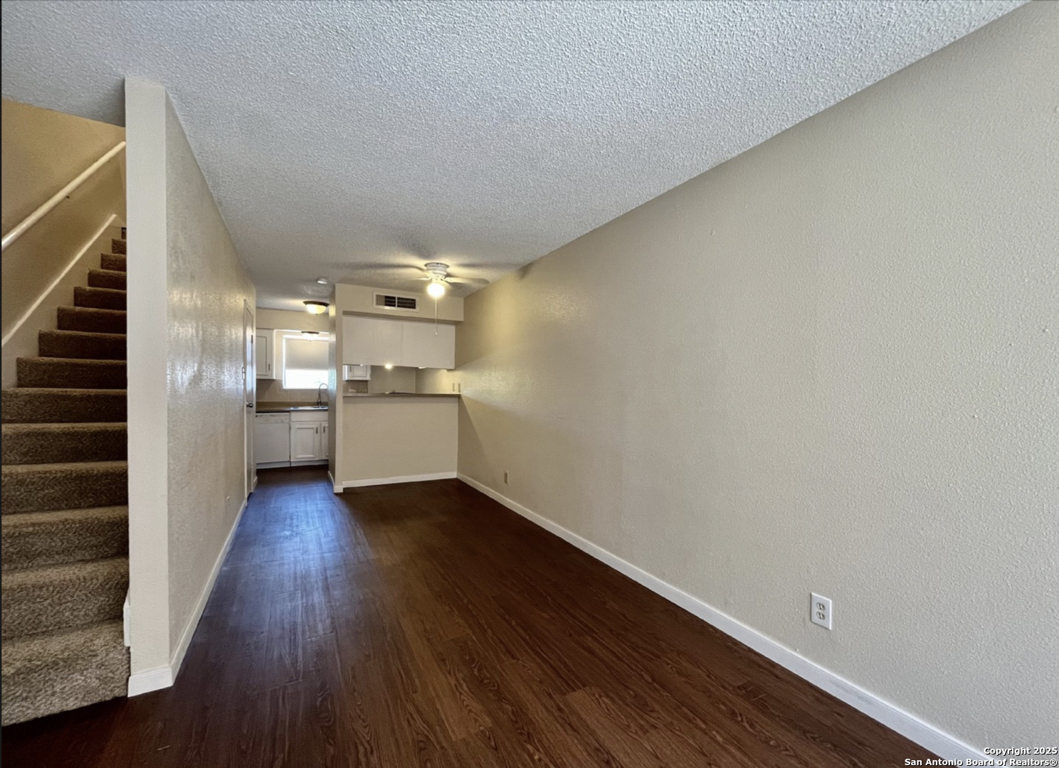 3243 Nacogdoches Road, Unit 404 San Antonio, TX 78217 - Photo 3 of 16 a view of a kitchen with wooden floor and electronic appliances