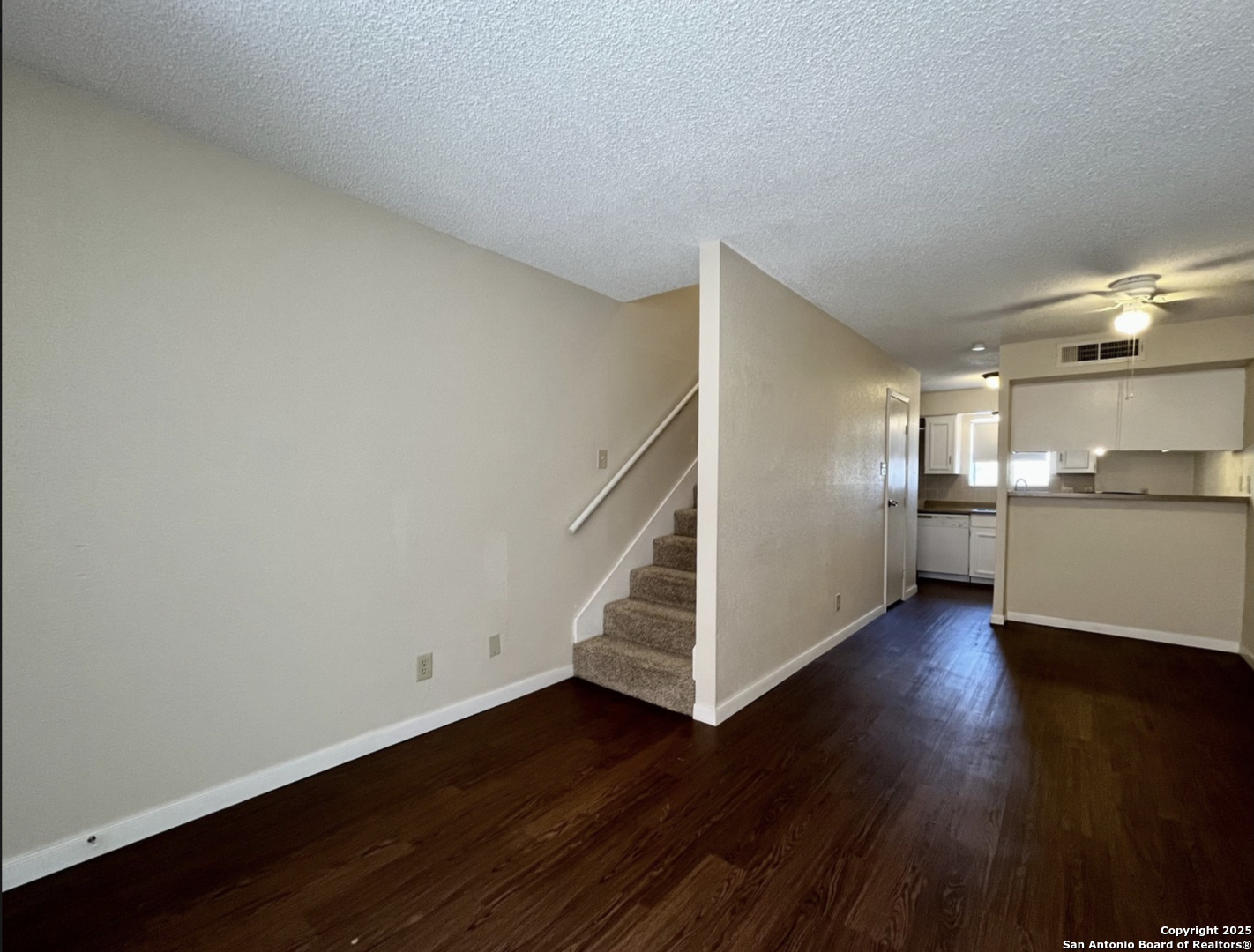 3243 Nacogdoches Road, Unit 404 San Antonio, TX 78217 - Photo 4 of 16 a view of a kitchen with wooden floor and electronic appliances