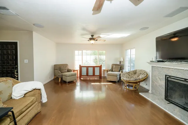a living room with furniture and a fireplace