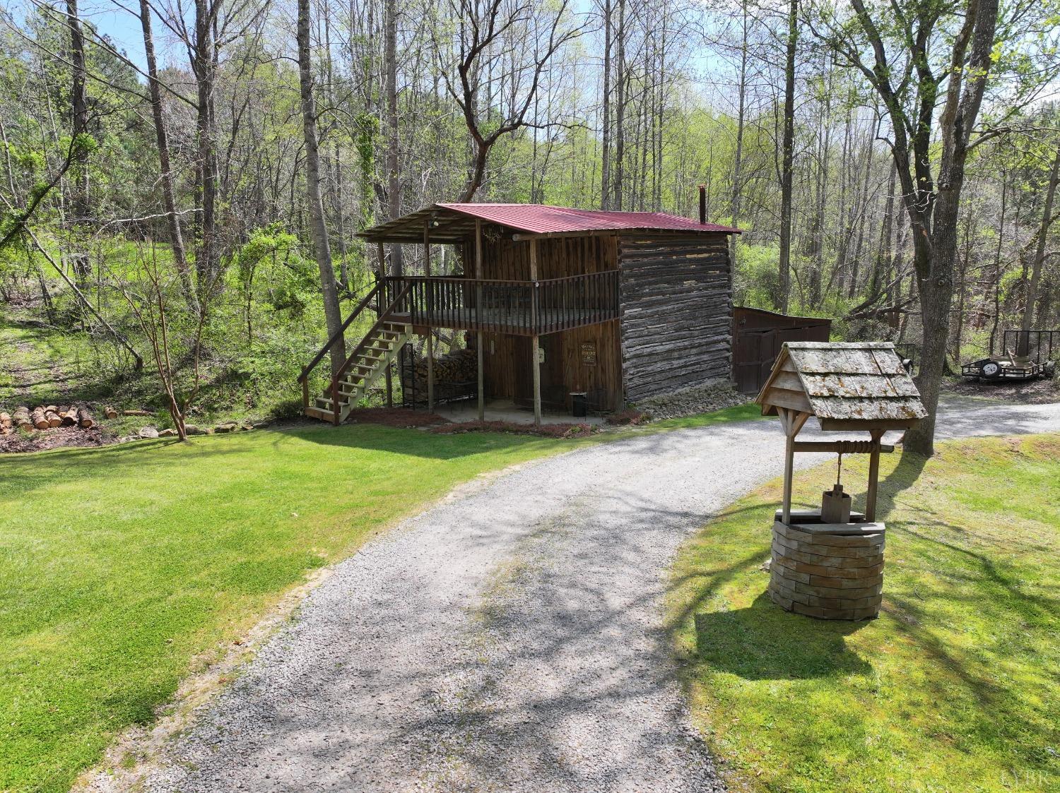120 Ripley Drive Danville, VA 24540 - Photo 16 of 71 a view of a patio with table and chairs with wooden fence and plants