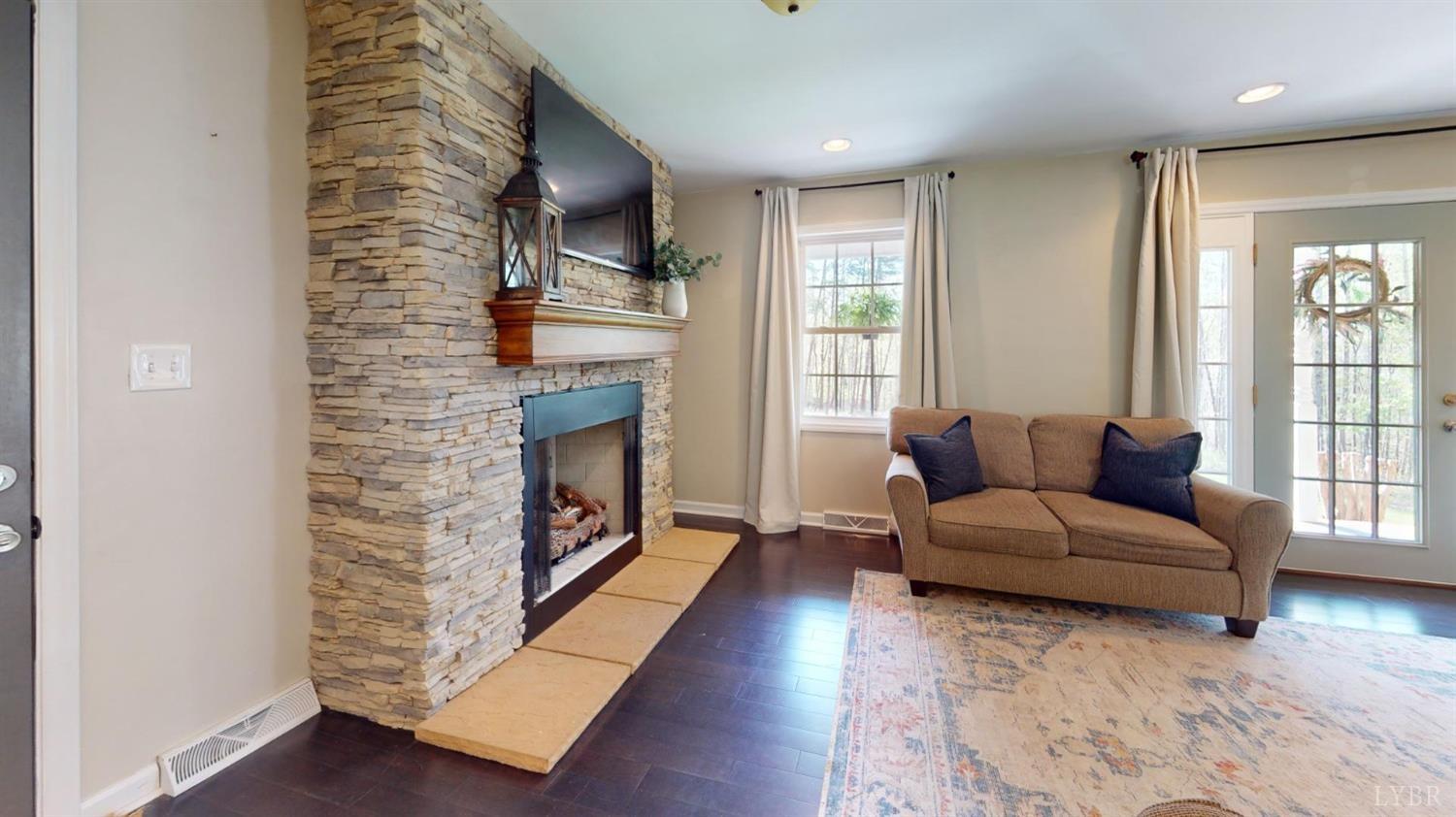 120 Ripley Drive Danville, VA 24540 - Photo 26 of 71 a living room with furniture and a fireplace