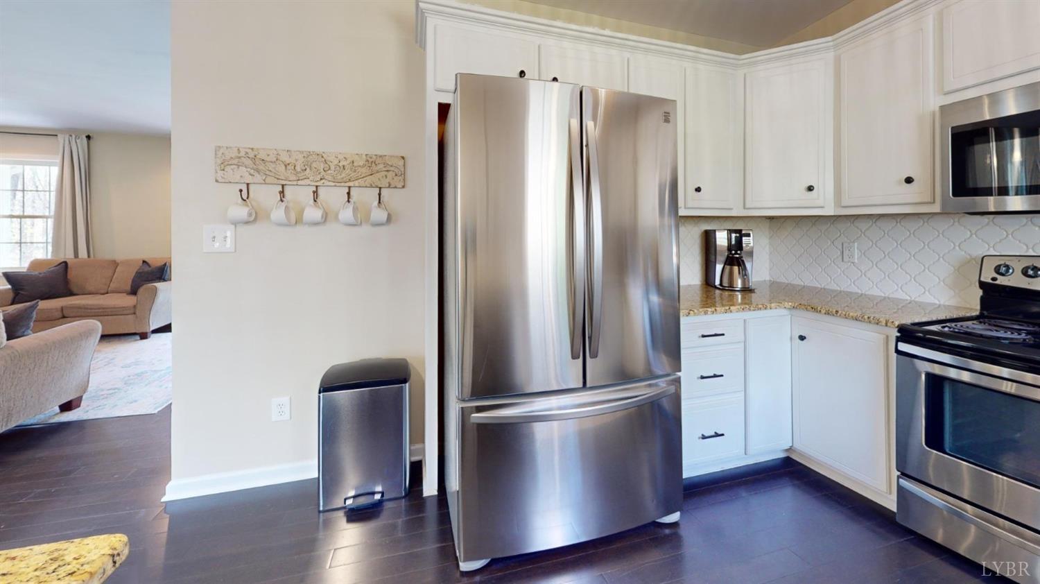 120 Ripley Drive Danville, VA 24540 - Photo 33 of 71 a kitchen with stainless steel appliances a refrigerator a stove a microwave and cabinets