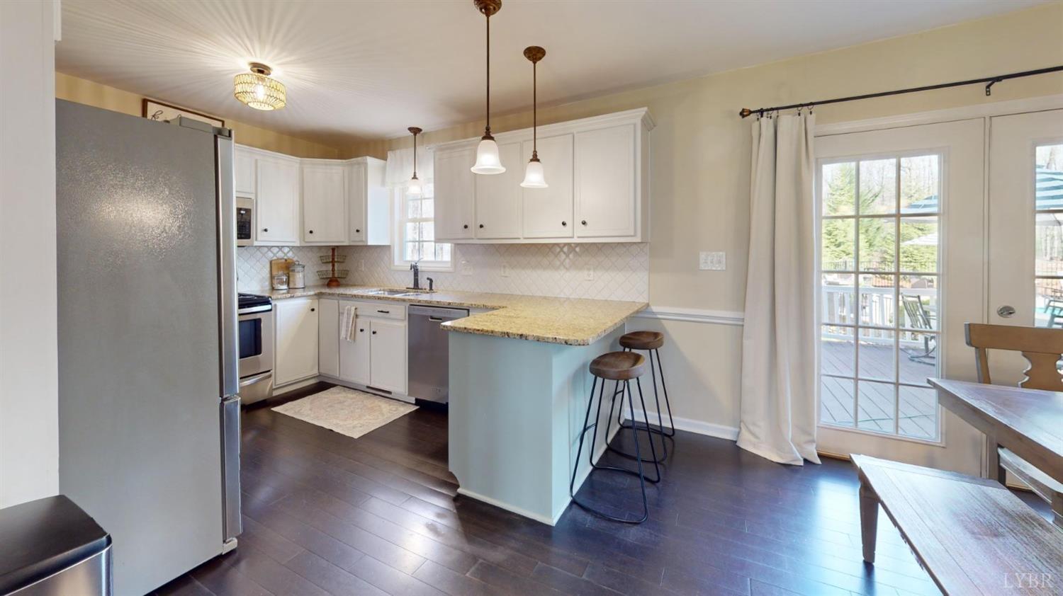 120 Ripley Drive Danville, VA 24540 - Photo 34 of 71 a kitchen with stainless steel appliances granite countertop a stove a sink dishwasher and a refrigerator with wooden floor