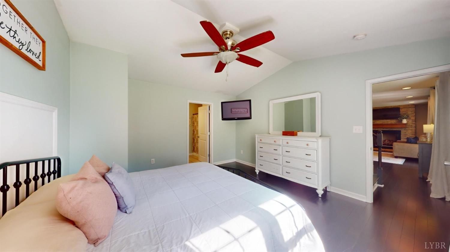 120 Ripley Drive Danville, VA 24540 - Photo 39 of 71 a bedroom with a bed and a chandelier