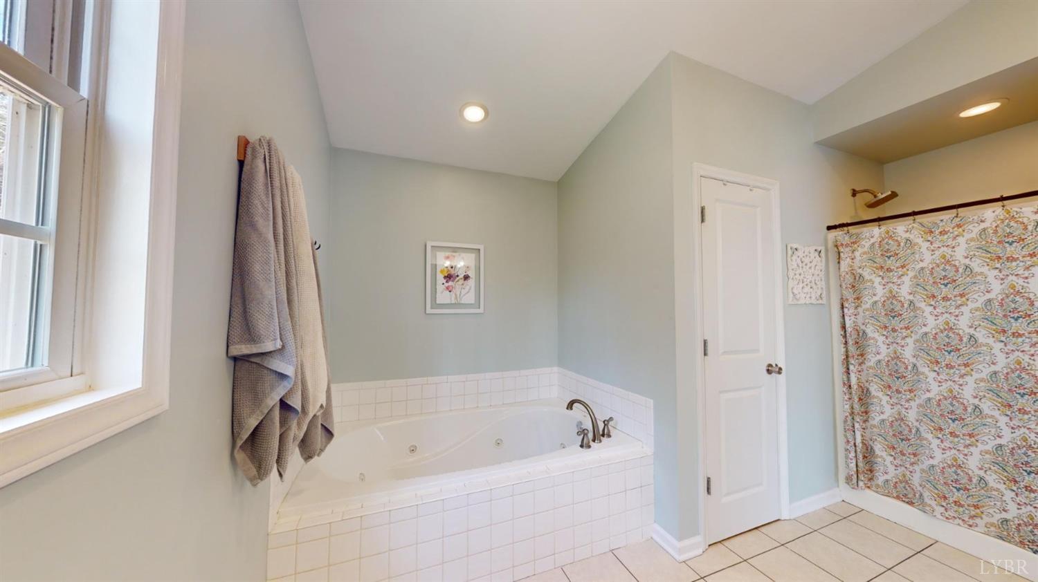 120 Ripley Drive Danville, VA 24540 - Photo 44 of 71 a bathroom with a tub a sink and a shower