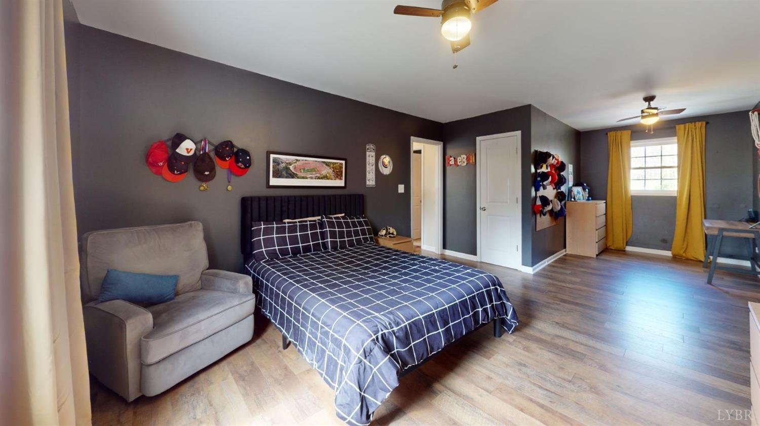 120 Ripley Drive Danville, VA 24540 - Photo 55 of 71 a bedroom with a bed and a chandelier