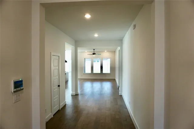 a view of gallery with wooden floor