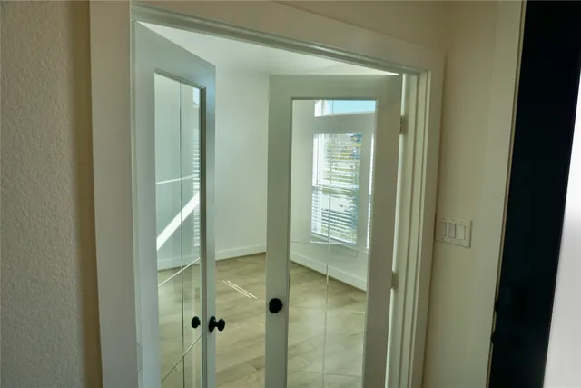 a view of a bathroom from a hallway