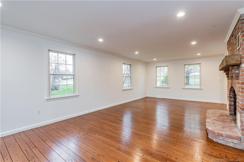 1241 Halladay Avenue West Suffield, CT 06078 - Photo 16 of 29 a view of an empty room with wooden floor and a window