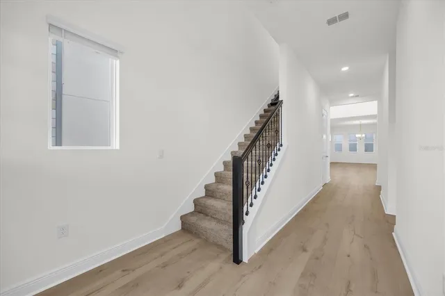 a view of entryway with wooden floor