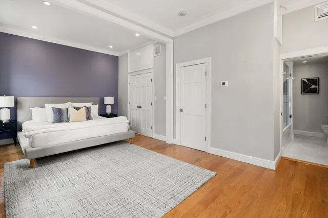 a bedroom with a bed and a table