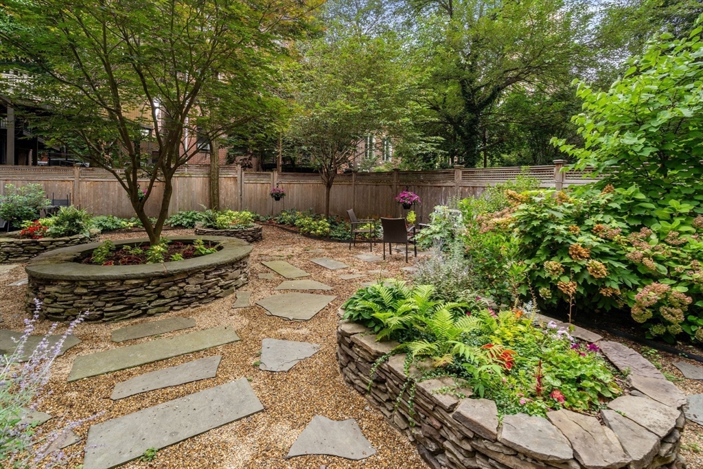 82 Berkeley Street, Unit 5 Boston, MA 02116 - Photo 27 of 32 a view of a backyard with plants and a garden
