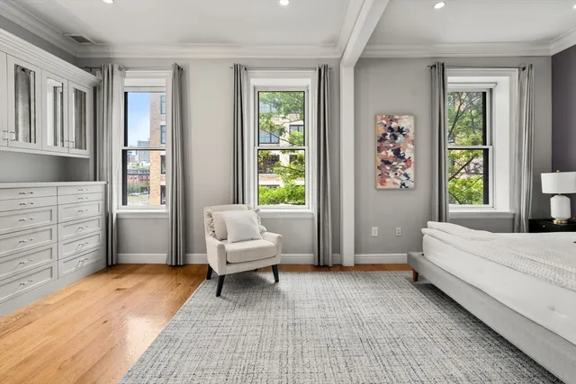 a bedroom with a bed and a couch