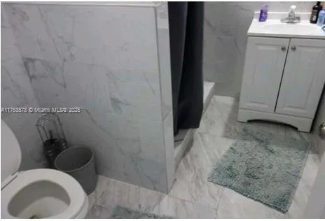 a bathroom with a sink and toilet