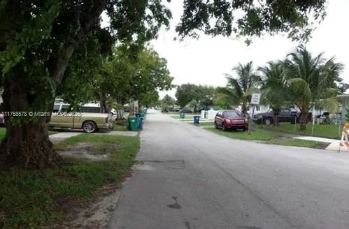 a view of street with parked cars