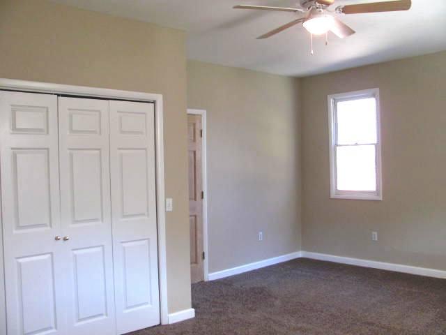 50 Sycamore Landing Road Waverly, TN 37185 - Photo 15 of 20 Brand new carpet and replacement windows throughout the home add coziness, especially in the bedrooms. Huge size bedrooms and high ceilings will make decorating so much fun!
