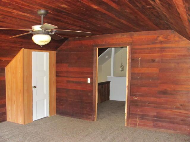 50 Sycamore Landing Road Waverly, TN 37185 - Photo 18 of 20 This is one of two almost idential upstairs spacious bedrooms that have the exposed tongue and groove walls and ceiling, two windows, ceiling fans and recently added closets.