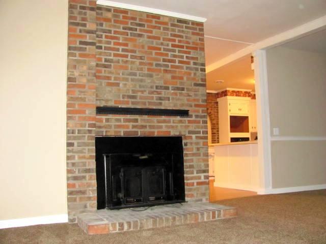 50 Sycamore Landing Road Waverly, TN 37185 - Photo 10 of 20 New carpet and fresh paint throughout the home complement the brick hearth and wood-burning Buck stove insert. This home's style is cozy comfortable!