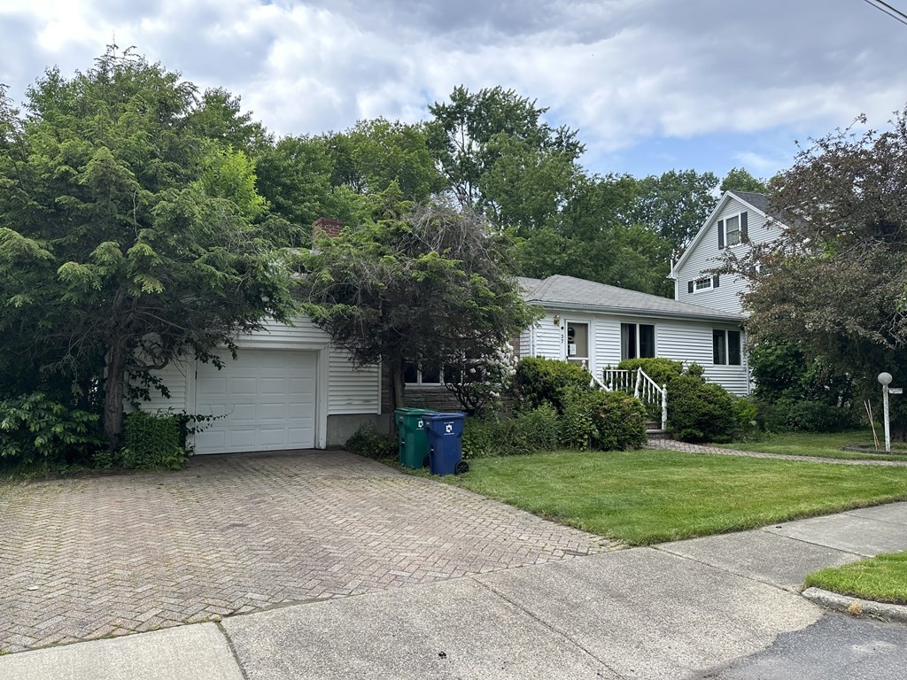 37 Selwyn Road Newton, MA 02461 - Photo 2 of 9 a front view of a house with a yard and garage