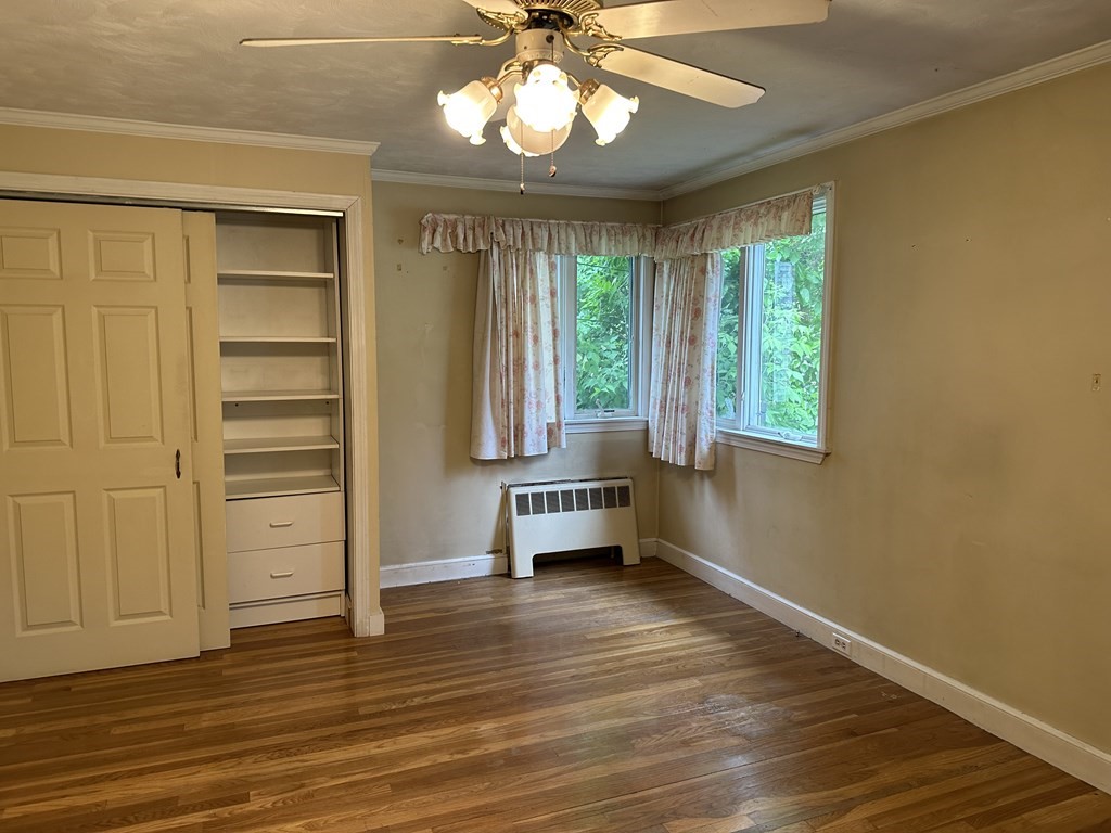 37 Selwyn Road Newton, MA 02461 - Photo 5 of 9 an empty room with windows and ceiling fan
