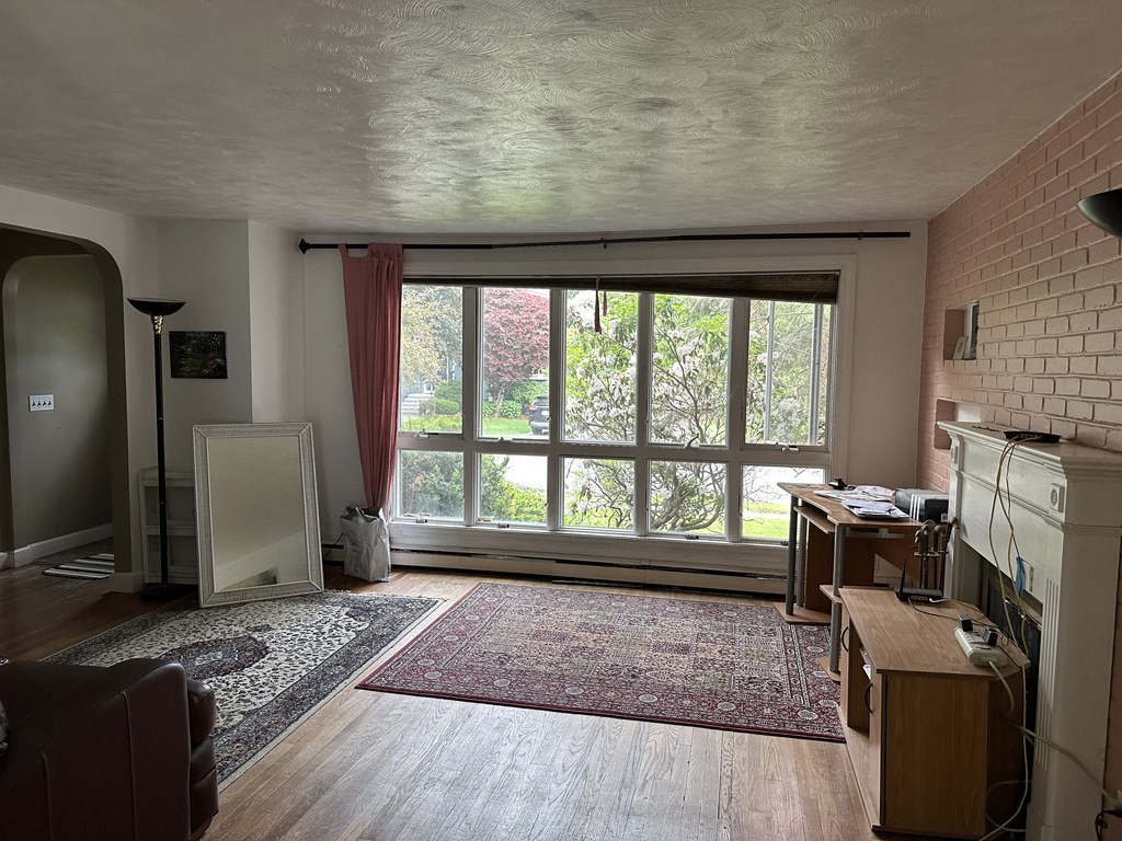 37 Selwyn Road Newton, MA 02461 - Photo 8 of 9 a living room with furniture and a fireplace