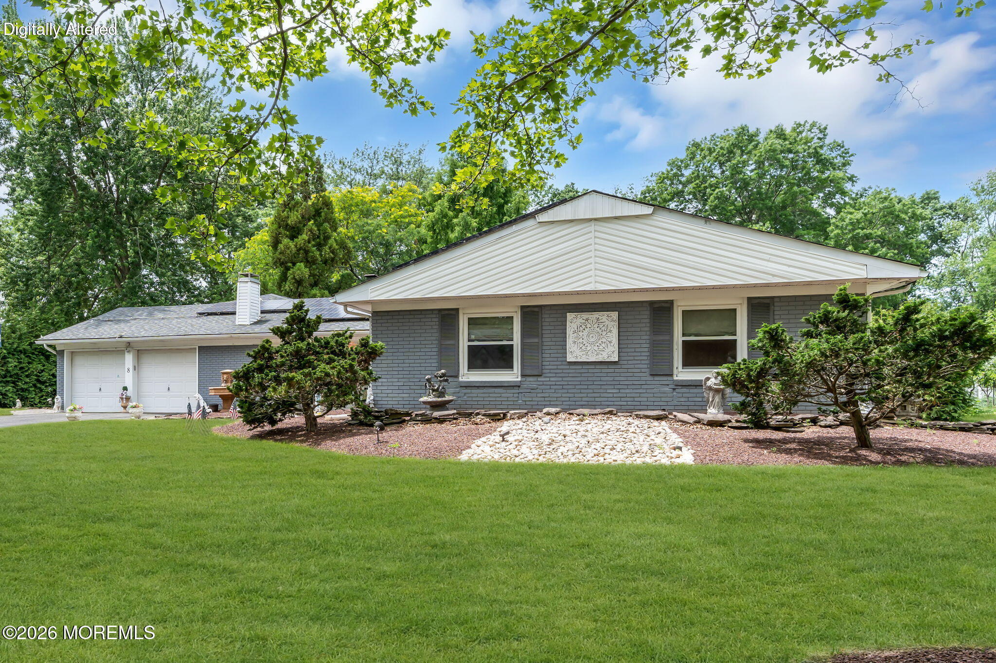 8 Owens Road Marlboro, NJ 07746 - Photo 3 of 39 a front view of a house with a garden and trees