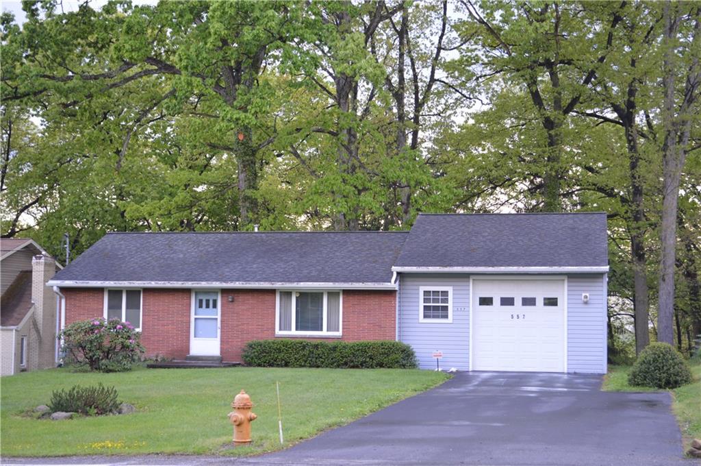 Charming, level entry ranch featuring paved drive, garage with a 9-foot door, and peaceful, wooded lot in the heart of Chippewa.  Brick and vinyl.