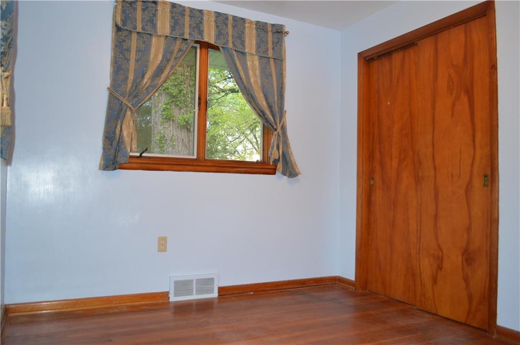 557 Shenango Road Beaver Falls, PA 15010 - Photo 13 of 25 A generous double closet in the Guest/2nd Bedroom, with a back yard view and warm hardwoods.