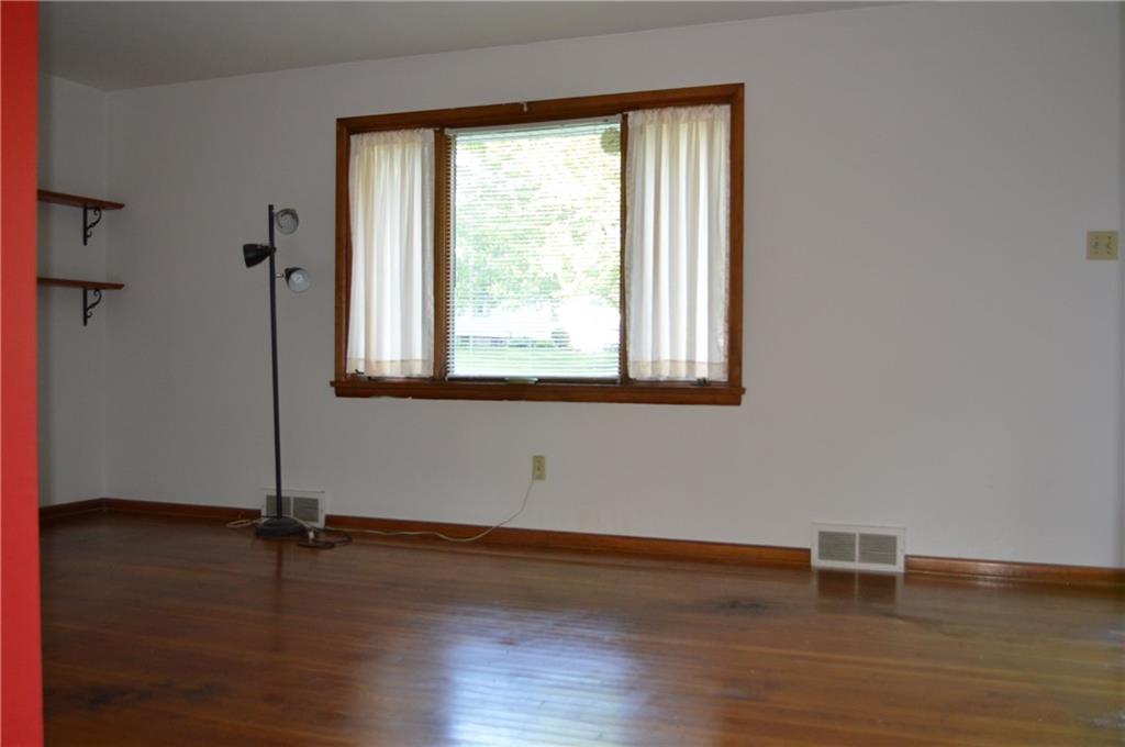 557 Shenango Road Beaver Falls, PA 15010 - Photo 8 of 25 The 18 x 12 living room offers natural light from the picture window, original hardwood and trim. Plenty of space to accommodate all your furniture!