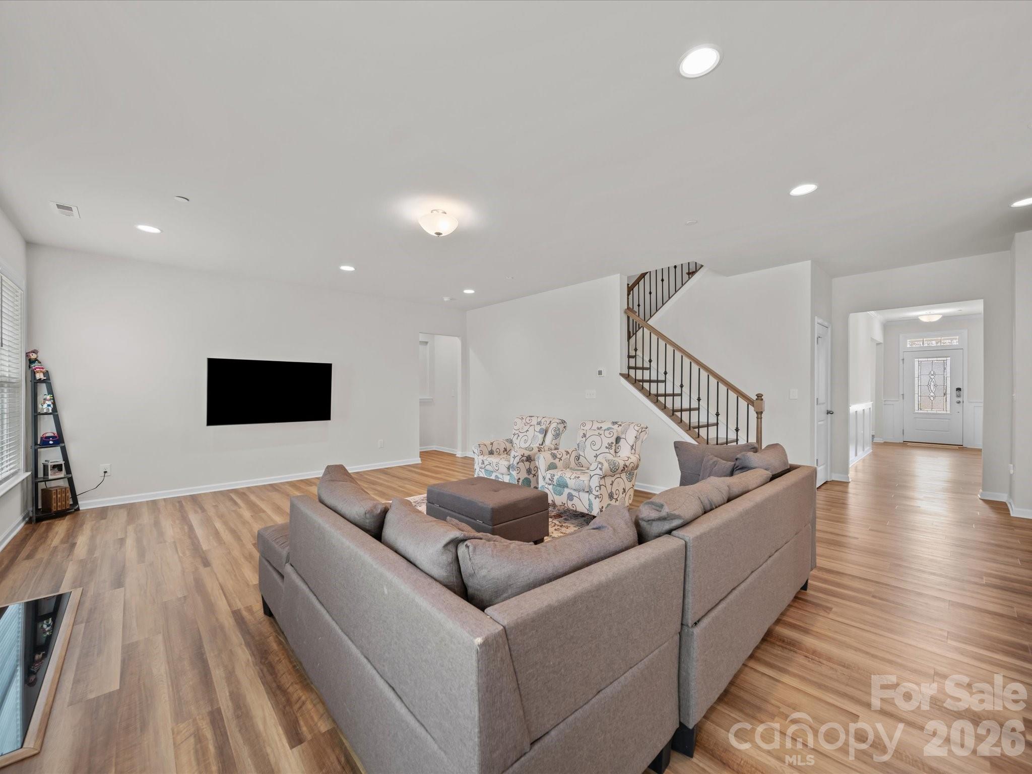 9582 Creighton Road Northwest Concord, NC 28027 - Photo 15 of 43 a living room with couches and a flat screen tv