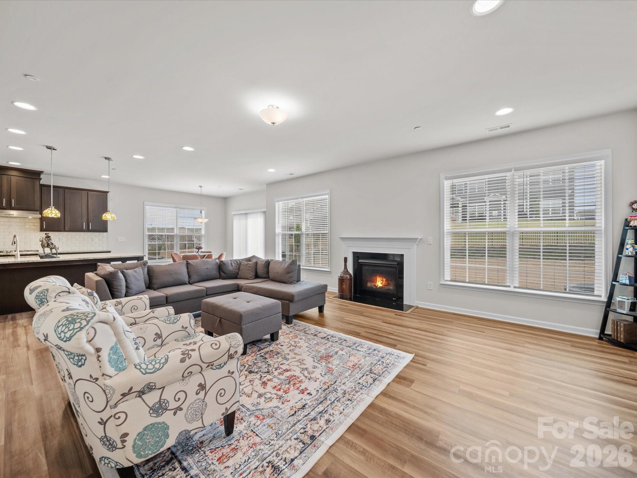 9582 Creighton Road Northwest Concord, NC 28027 - Photo 16 of 43 a living room with furniture window and a fireplace